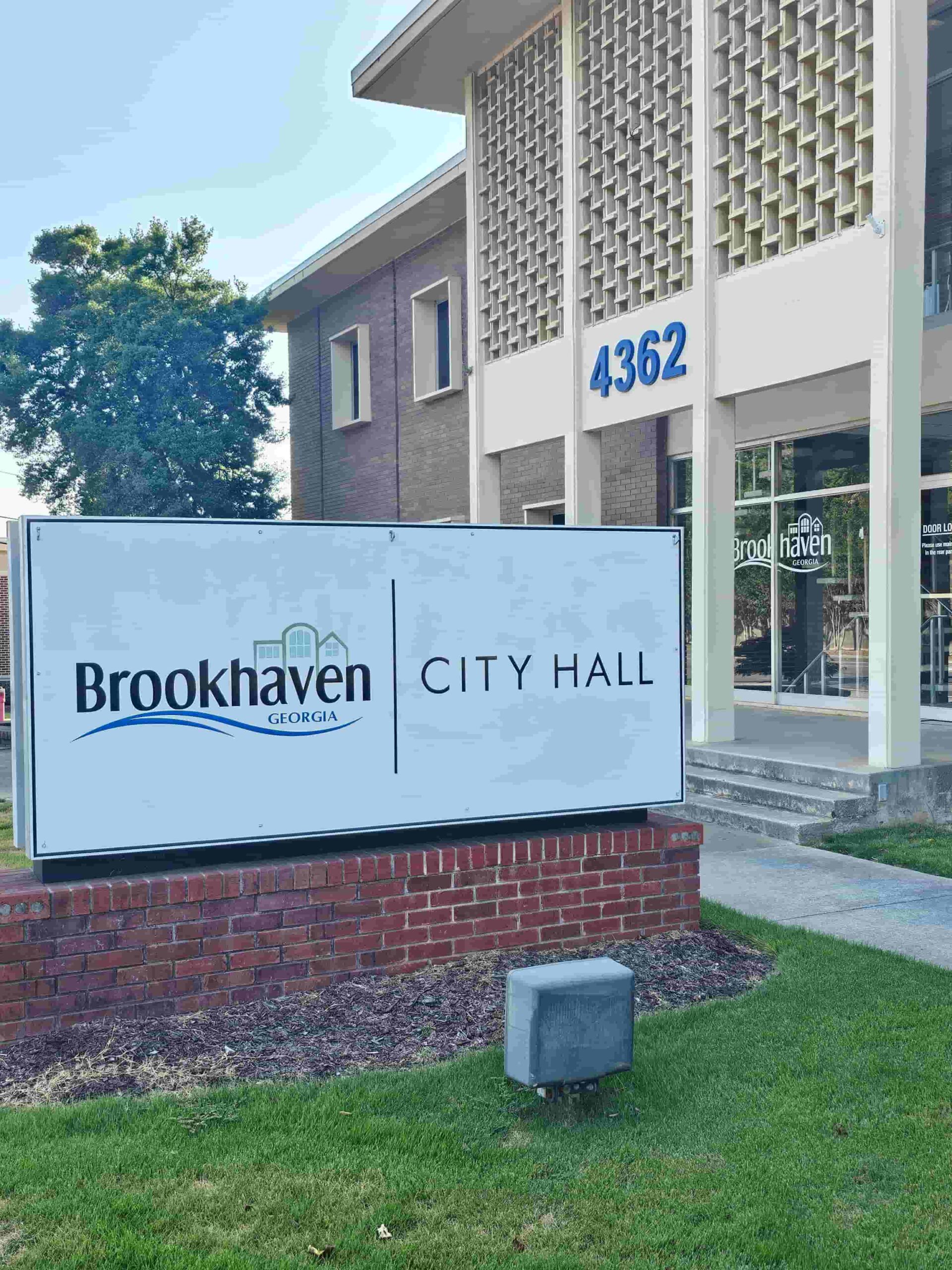 An image of Brookhaven City Hall sign with Metro Acupuncture